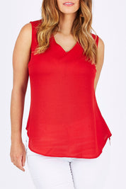 Model Laura wearing size 12 of the Cami Top in colour Red (Red), from the front, cropped image
