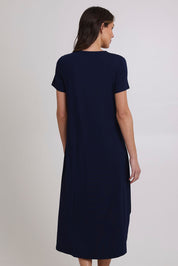 Model Madeline wearing size 10 of the Summer Cotton Blend Pocket Dress in colour Navy (Blue), from the back