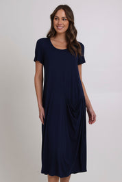 Model Madeline wearing size 10 of the Summer Cotton Blend Pocket Dress in colour Navy (Blue), from the front, cropped image