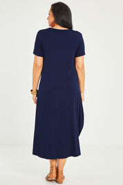Model Noli wearing size 14 of the Summer Cotton Blend Pocket Dress in colour Navy (Blue), from the back
