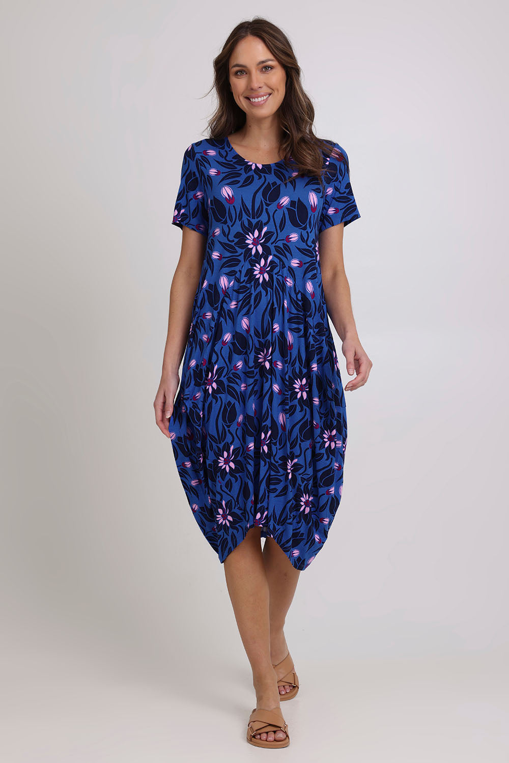 Model Madeline wearing size 10 of The Bounce Dress in colour Blue (Blue), from the front, showing the whole outfit