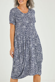 Model Luisa wearing size 10 of The Bounce Dress in colour Navy (Blue), from the front, cropped image