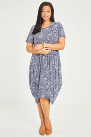 Model Terri-Leigh wearing size 10 of The Bounce Dress in colour Navy (Blue), from the front, showing the whole outfit