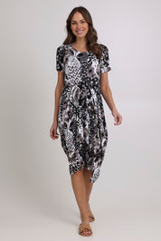 Model Madeline wearing size 10 of The Bounce Dress in colour Silverblk (Black), from the front, showing the whole outfit