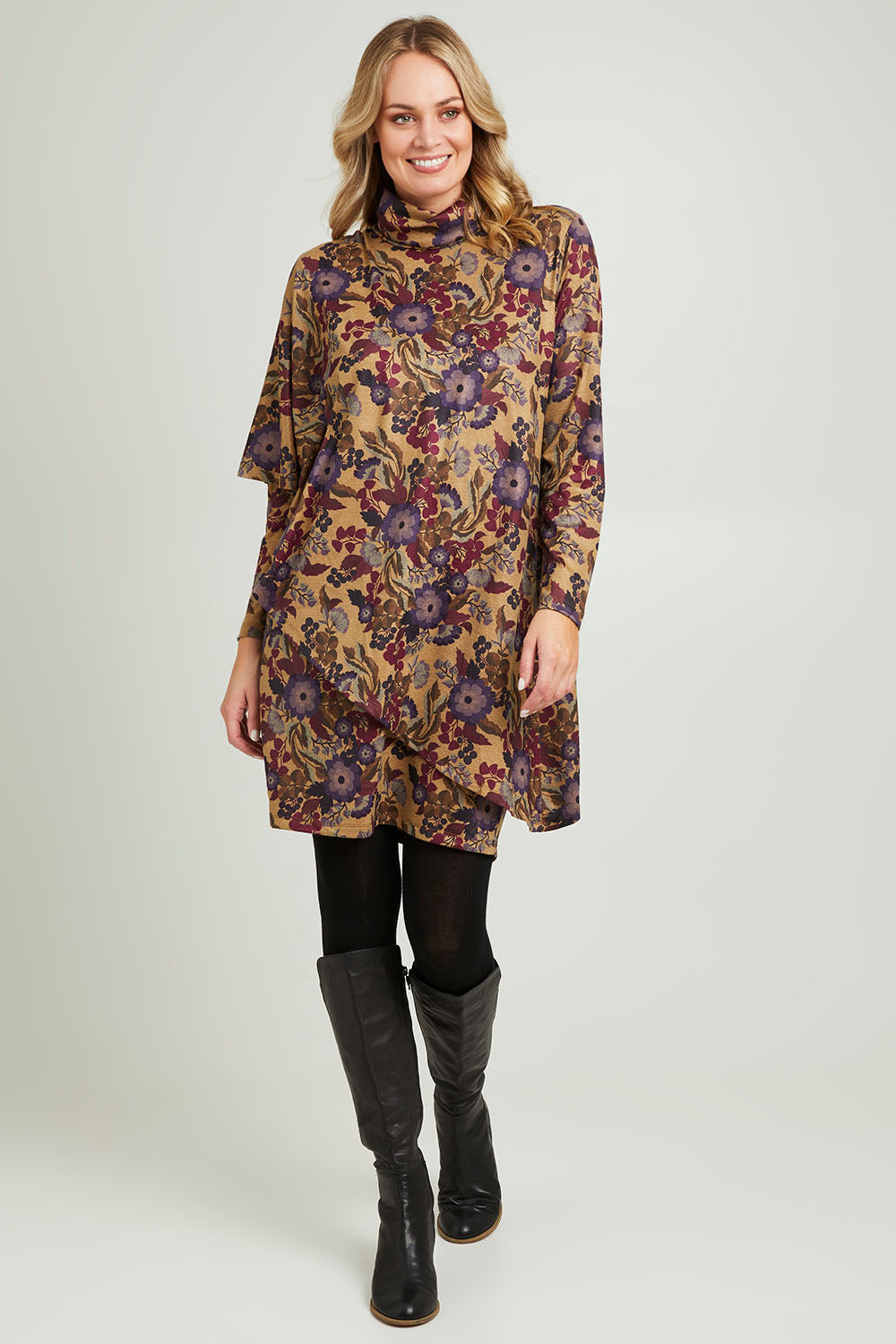 Model Grace wearing size 10 of the Printed Cape Dress in colour Plum, from the front, showing the whole outfit