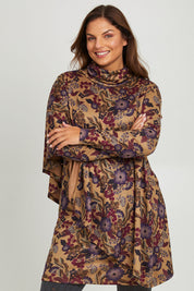 Model Monique wearing size 14 of the Printed Cape Dress in colour Plum, from the front, cropped image