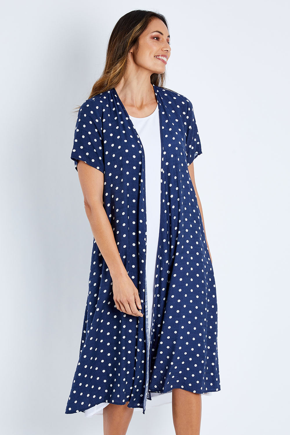 Model Amanda wearing size 10 of the Dotty Jacket in colour Navyspot (Blue), from the front, cropped image