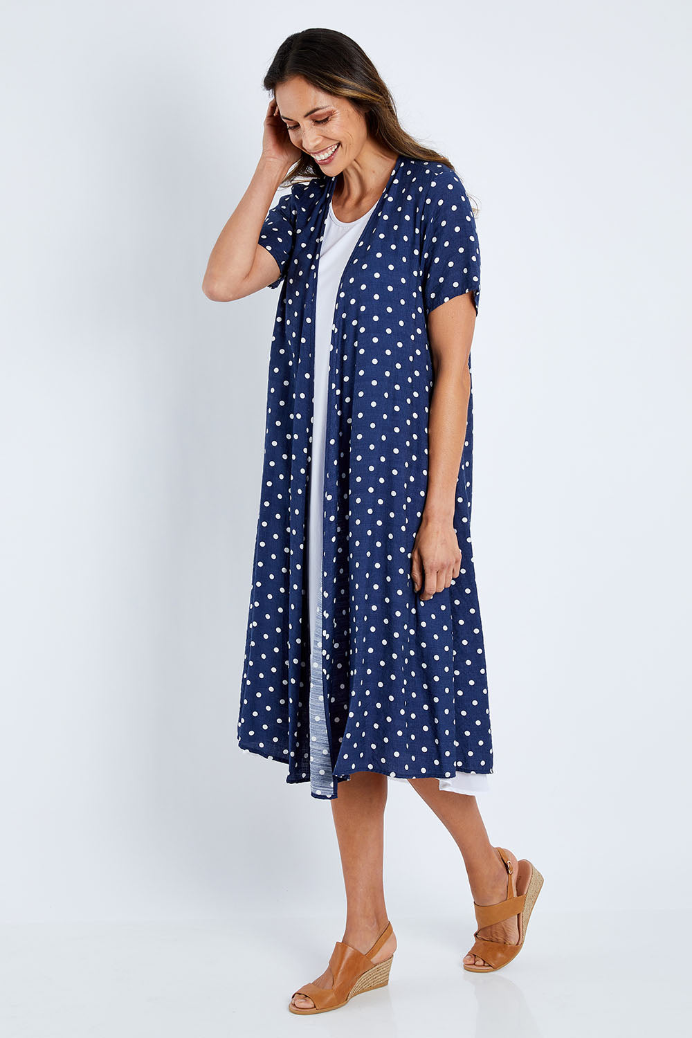 Model Amanda wearing size 10 of the Dotty Jacket in colour Navyspot (Blue), from the front, showing the whole outfit