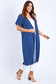 Model Laura wearing size 14 of the Dotty Jacket in colour Navyspot (Blue), from the front, showing the whole outfit
