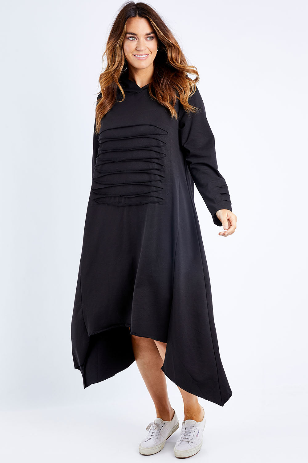 Model Laura wearing size 14 of the Lifestyle Hoody Dress in colour Black (Black), from the front, showing the whole outfit