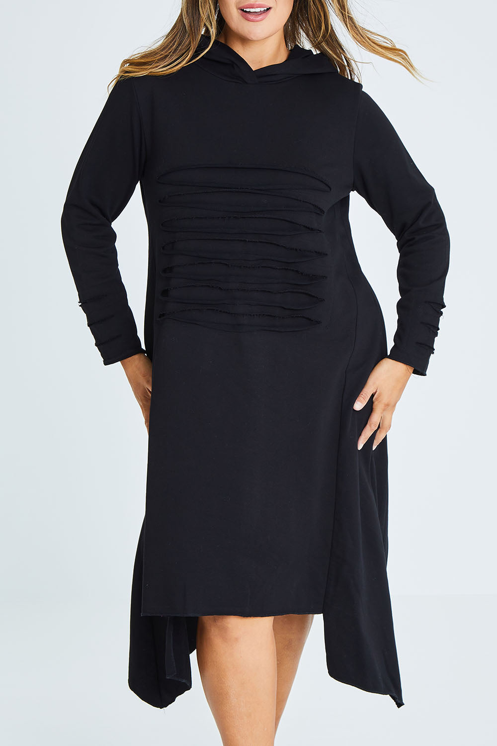 Model Palatina wearing size 16 of the Lifestyle Hoody Dress in colour Black (Black), from the front, cropped image