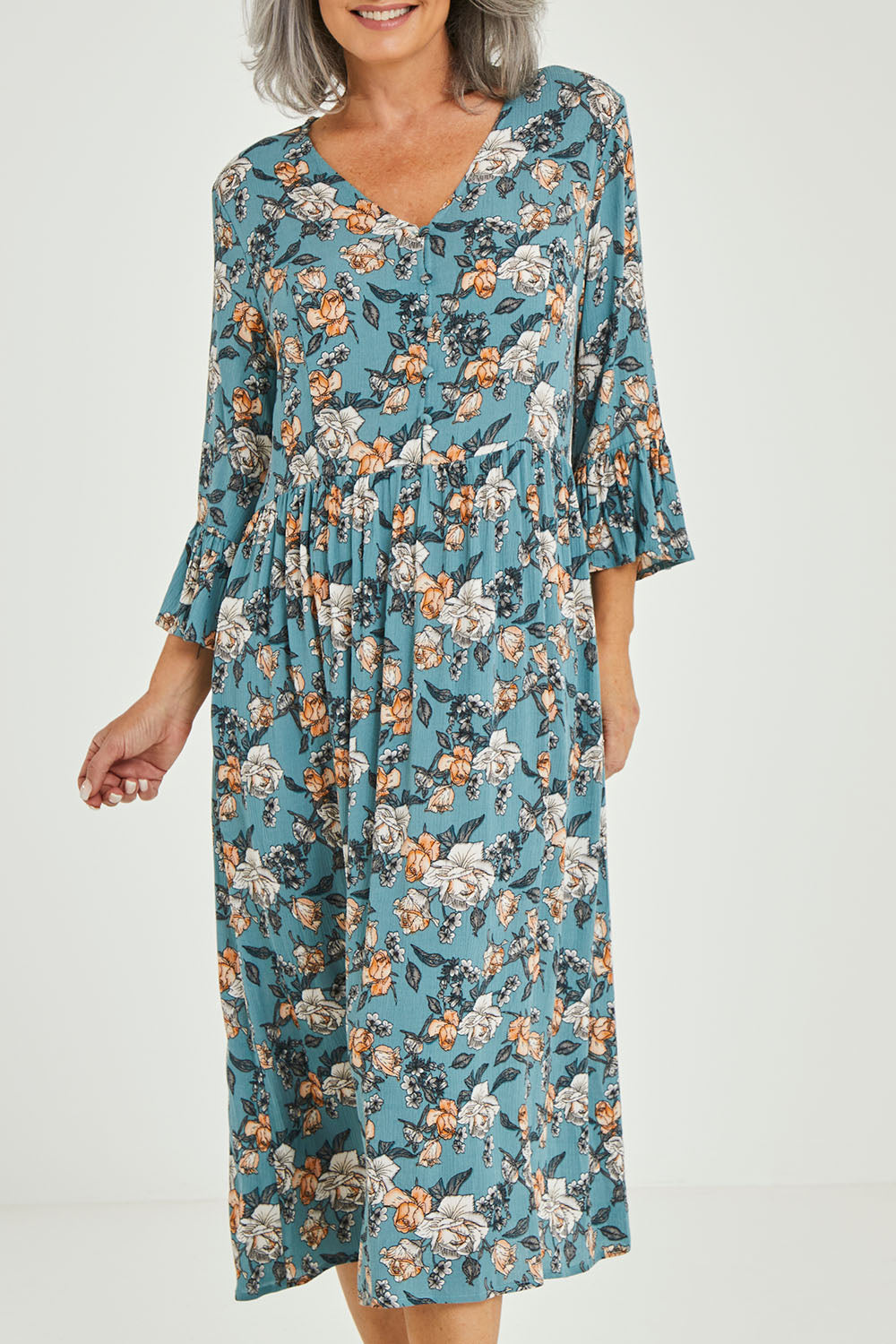 Model Luisa wearing size 10 of the Gemma Ruffle Dress in colour Mint (Green), from the front, cropped image