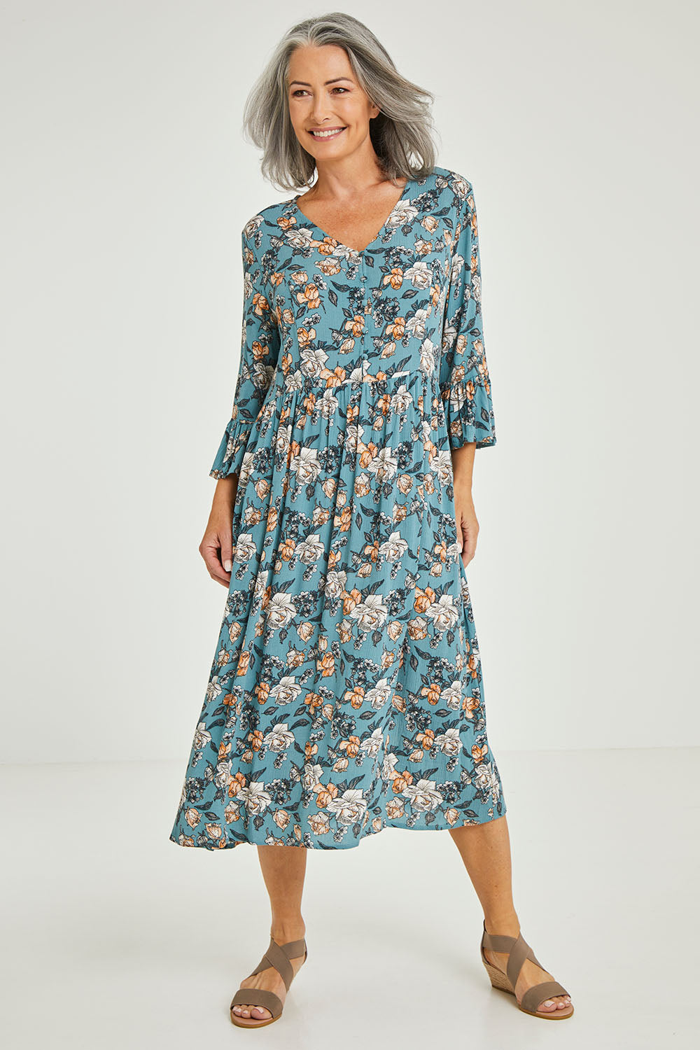 Model Luisa wearing size 10 of the Gemma Ruffle Dress in colour Mint (Green), from the front, showing the whole outfit
