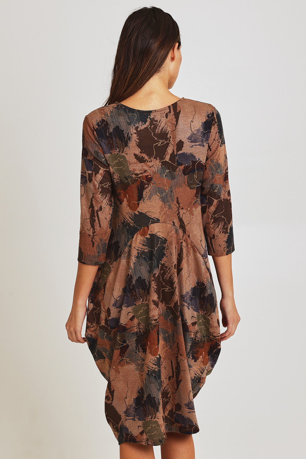 Model Madeline wearing size 10 of the Bounce Dress in colour Green, from the back