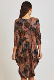 Model Madeline wearing size 10 of the Bounce Dress in colour Green, from the back
