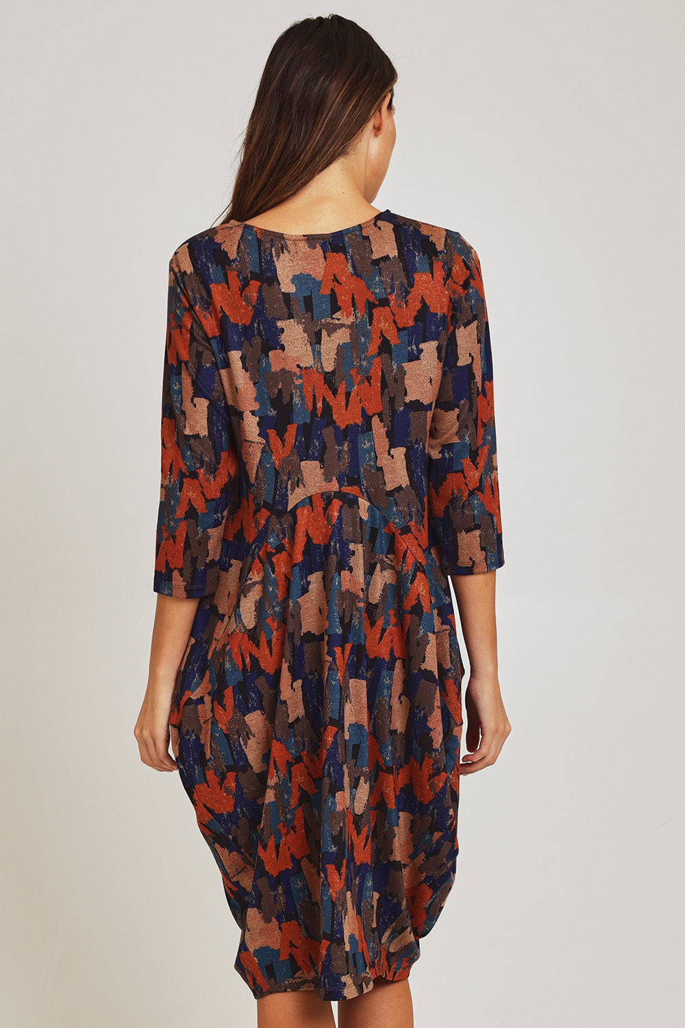 Model Madeline wearing size 10 of the Bounce Dress in colour Multi, from the back