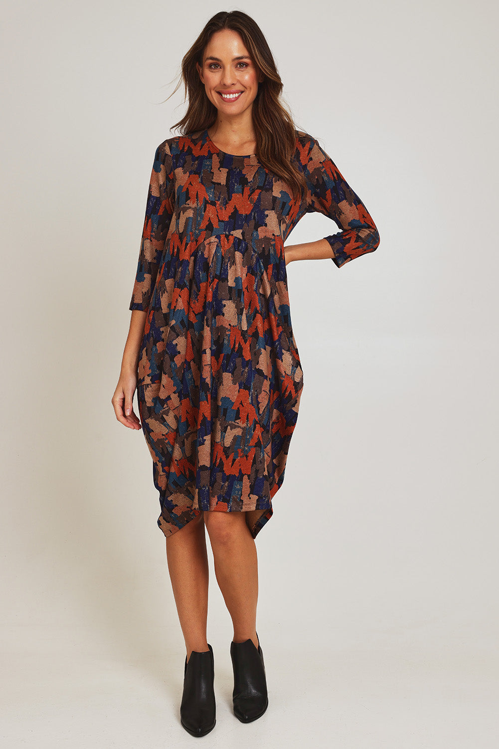 Model Madeline wearing size 10 of the Bounce Dress in colour Multi, from the front, showing the whole outfit