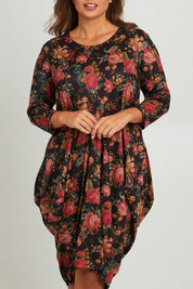 Model Monique wearing size 14 of the Bounce Dress in colour Paisley (Black), from the front, cropped image