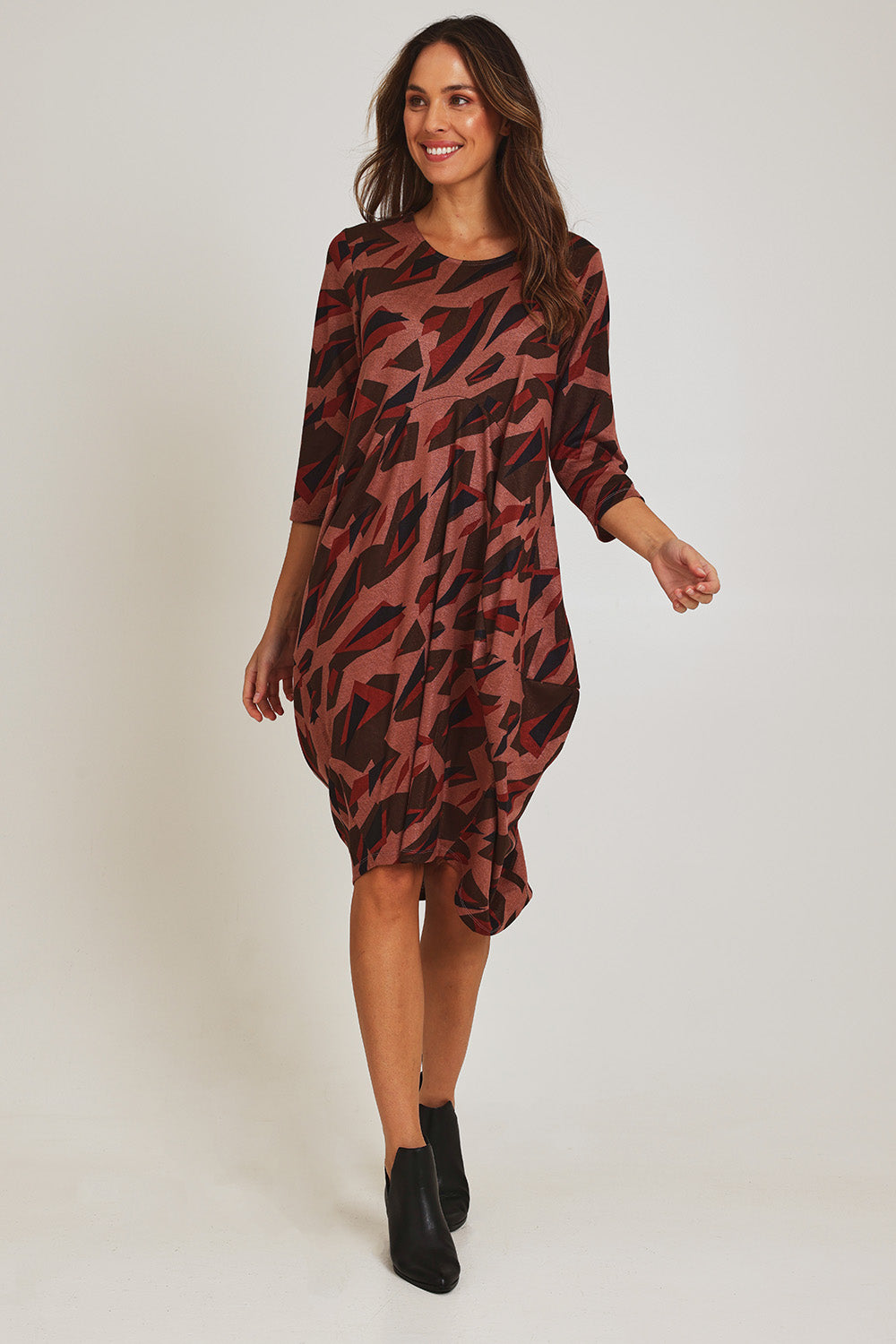 Model Madeline wearing size 10 of the Bounce Dress in colour Pinkred (Pink), from the front, showing the whole outfit