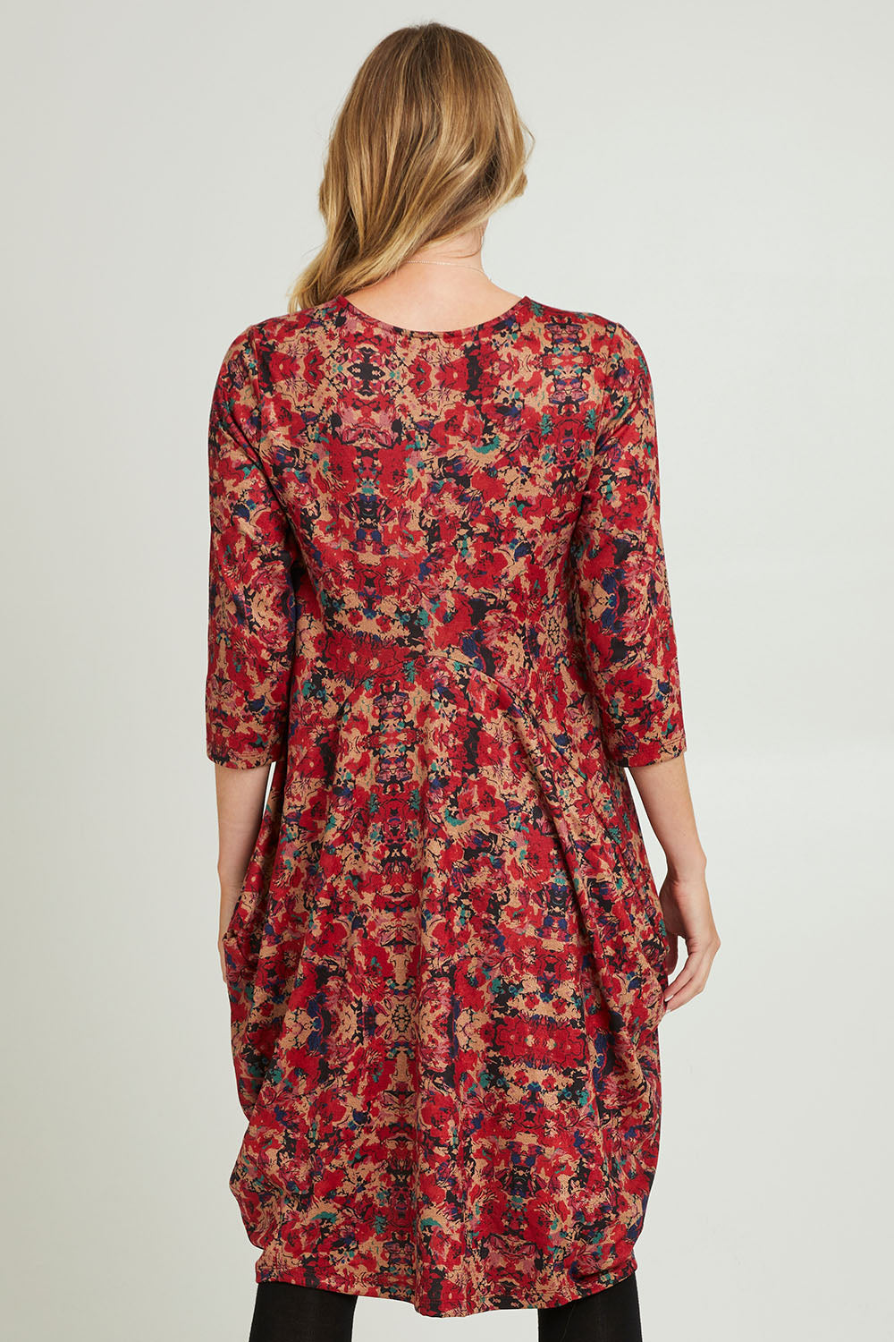 Model Grace wearing size 10 of the Bounce Dress in colour Red (Red), from the back