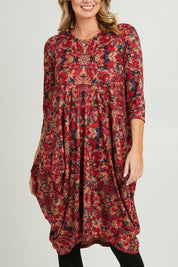 Model Grace wearing size 10 of the Bounce Dress in colour Red (Red), from the front, cropped image