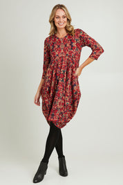 Model Grace wearing size 10 of the Bounce Dress in colour Red (Red), from the front, showing the whole outfit