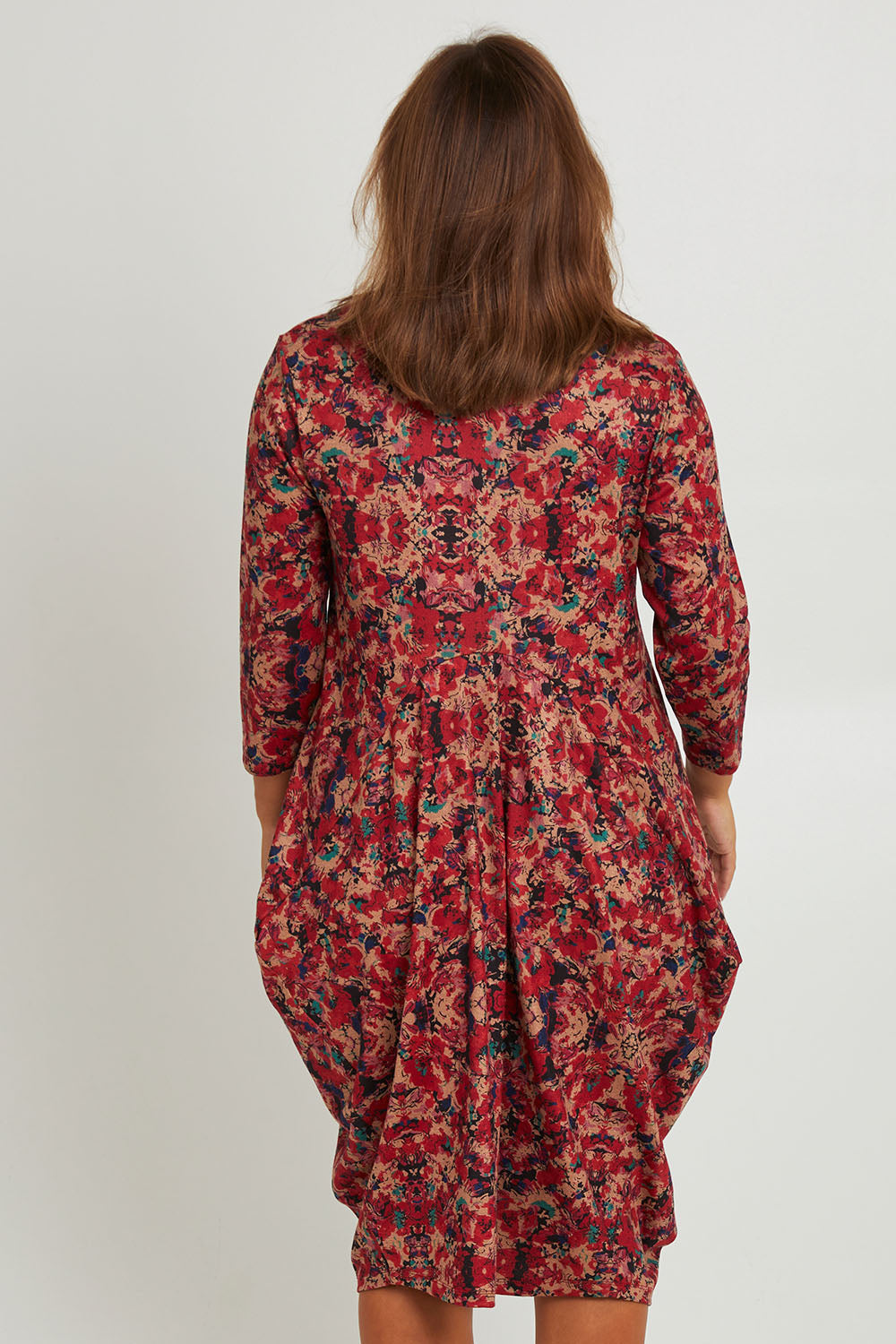 Model Monique wearing size 14 of the Bounce Dress in colour Red (Red), from the back