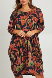 Model Monique wearing size 14 of the Bounce Dress in colour Royal (Blue), from the front, cropped image