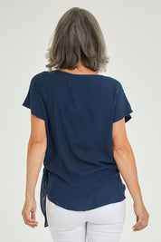 Model Luisa wearing size 10 of the Bora Bora Top in colour Navy (Blue), from the back