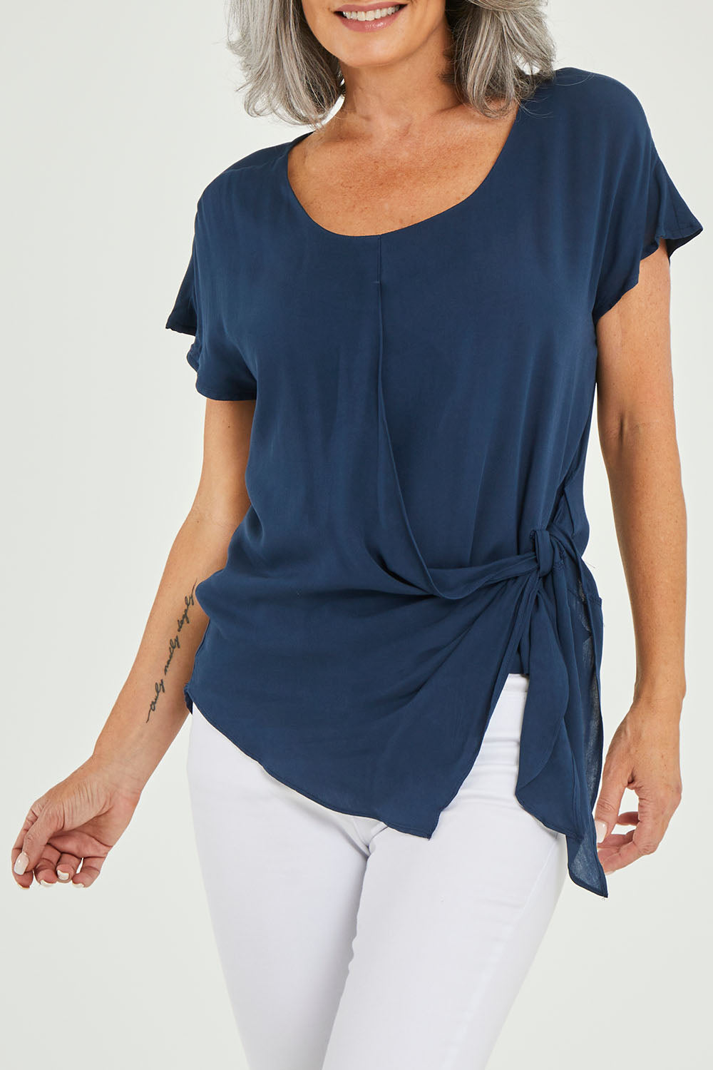 Model Luisa wearing size 10 of the Bora Bora Top in colour Navy (Blue), from the front, cropped image