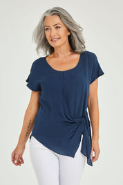 Model Luisa wearing size 10 of the Bora Bora Top in colour Navy (Blue), from the front, cropped image