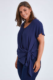 Model Monique wearing size 14 of the Bora Bora Top in colour Navy (Blue), from the front, cropped image