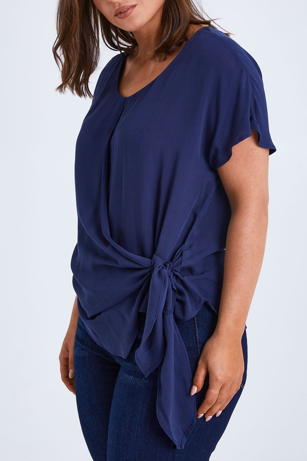 Model Monique wearing size 14 of the Bora Bora Top in colour Navy (Blue), from the front, cropped image