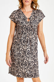 Model Naomi wearing size 10 of the Print Dress in colour Print, from the front, cropped image