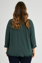 Model Laura wearing size 14 of the Ruffle 3/4 Sleeve Top in colour Forest (Green), from the back