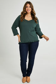 Model Laura wearing size 14 of the Ruffle 3/4 Sleeve Top in colour Forest (Green), from the front, showing the whole outfit