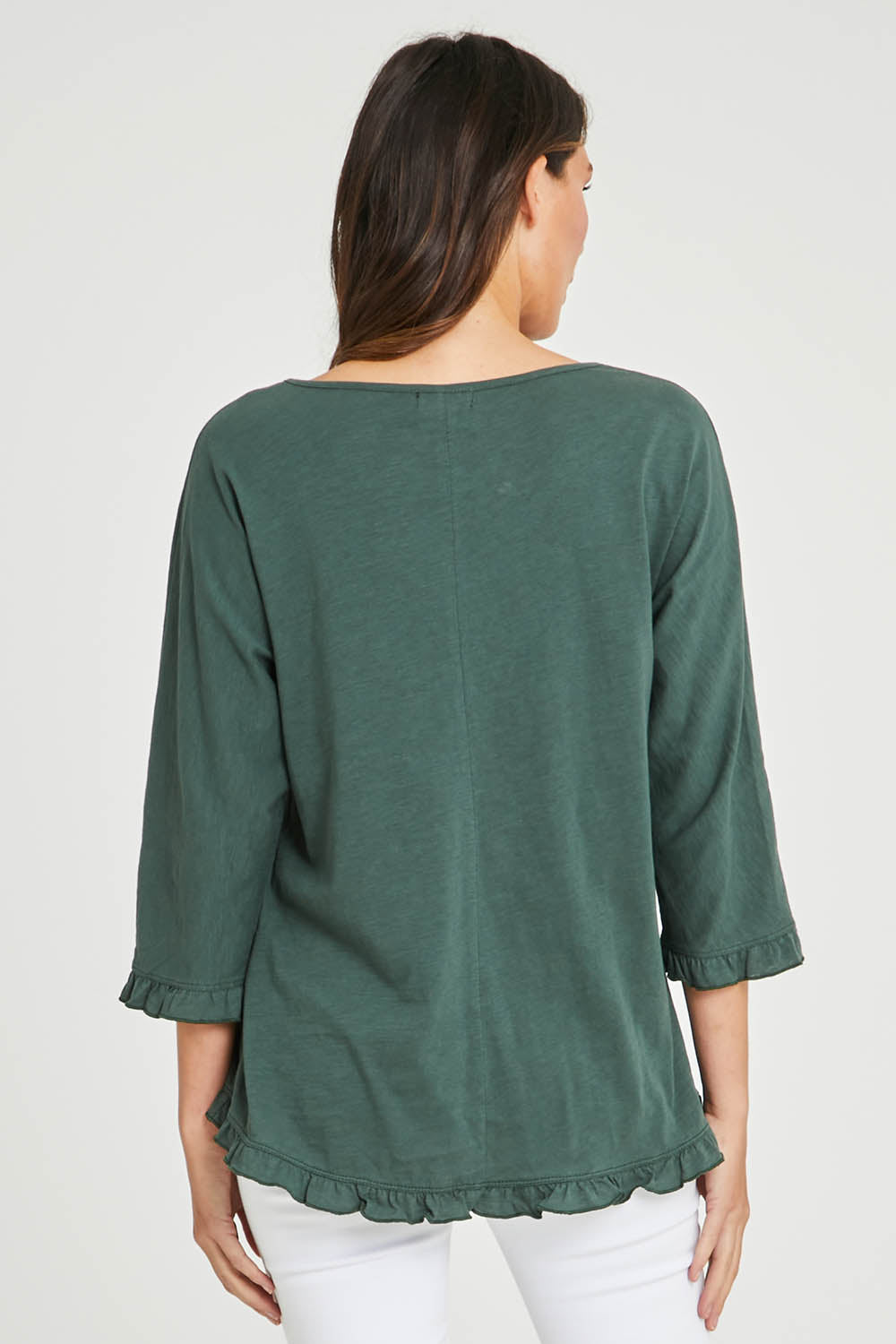Model Madeline wearing size 10 of the Ruffle 3/4 Sleeve Top in colour Forest (Green), from the back