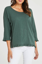 Model Madeline wearing size 10 of the Ruffle 3/4 Sleeve Top in colour Forest (Green), from the front, cropped image