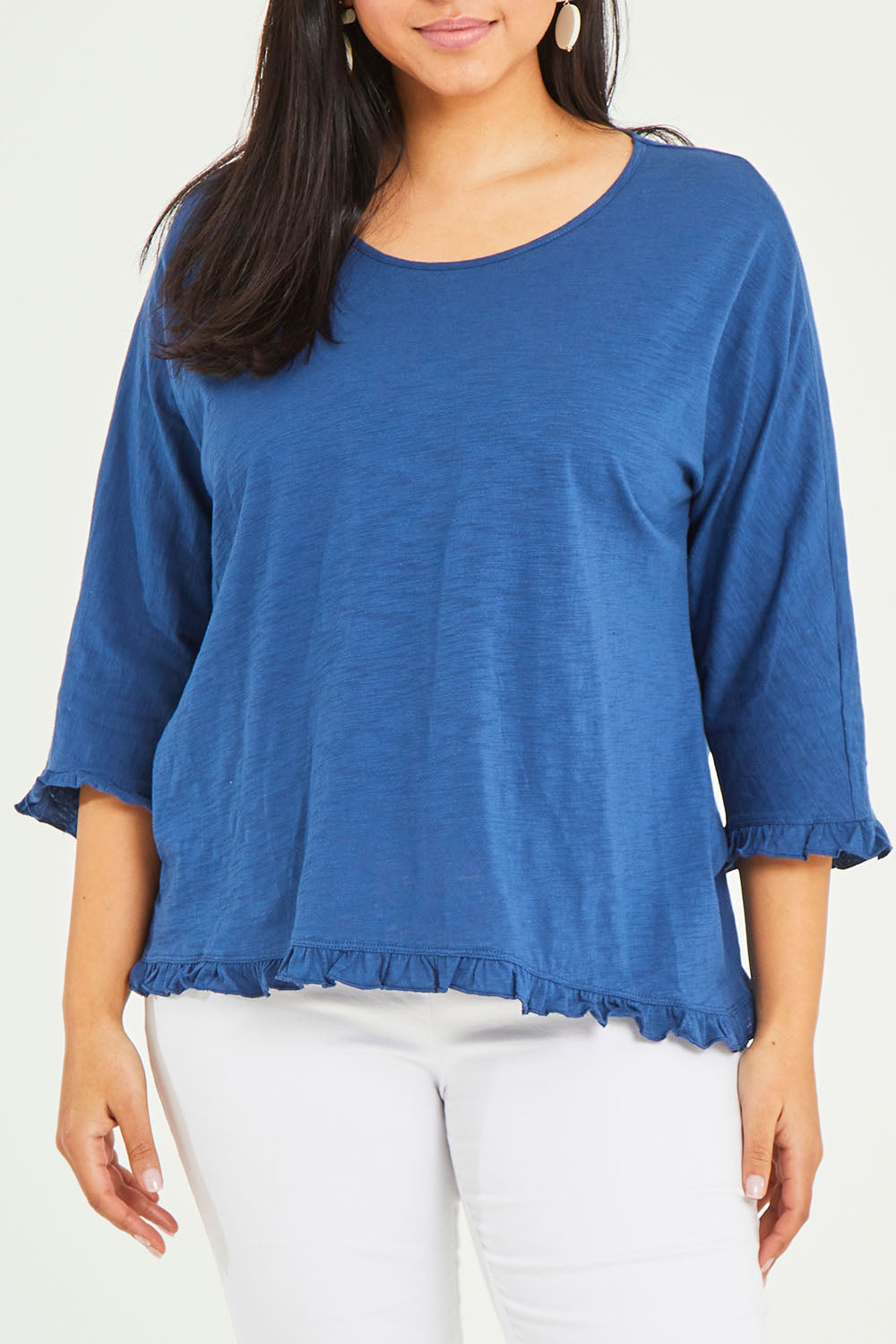 Model Terri-Leigh wearing size 14 of the Ruffle 3/4 Sleeve Top in colour Navy (White), from the front, cropped image
