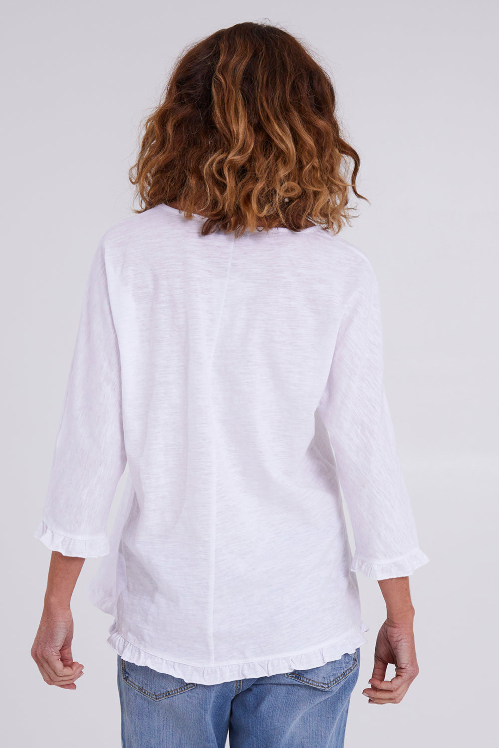 Model Emma wearing size 10 of the Ruffle 3/4 Sleeve Top in colour White (White), from the back