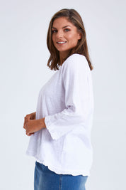 Model Monique wearing size 14 of the Ruffle 3/4 Sleeve Top in colour White (White), from the front, cropped image