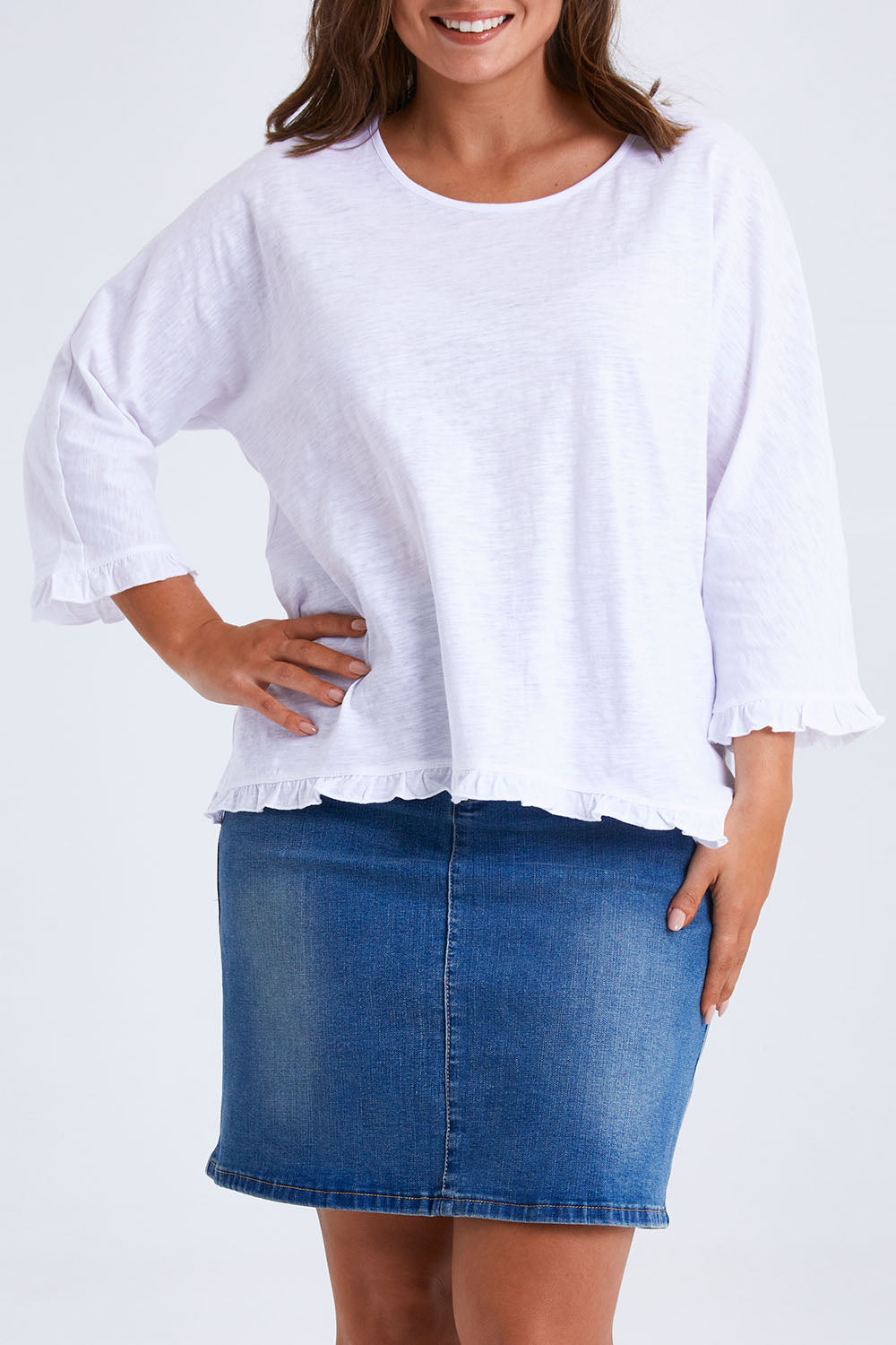 Model Monique wearing size 14 of the Ruffle 3/4 Sleeve Top in colour White (White), from the front, cropped image