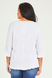 Model Terri-Leigh wearing size 14 of the Ruffle 3/4 Sleeve Top in colour White (White), from the back