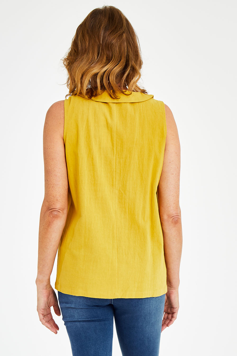 Model Naomi wearing size 10 of the Upcycle Cowly Top in colour Sunflower, from the back