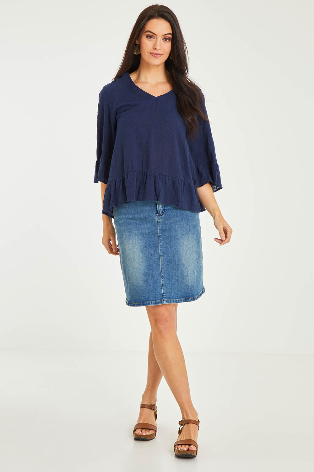 Model Stacey wearing size 10 of the Ruffle Top in colour Navy (Blue), from the front, showing the whole outfit