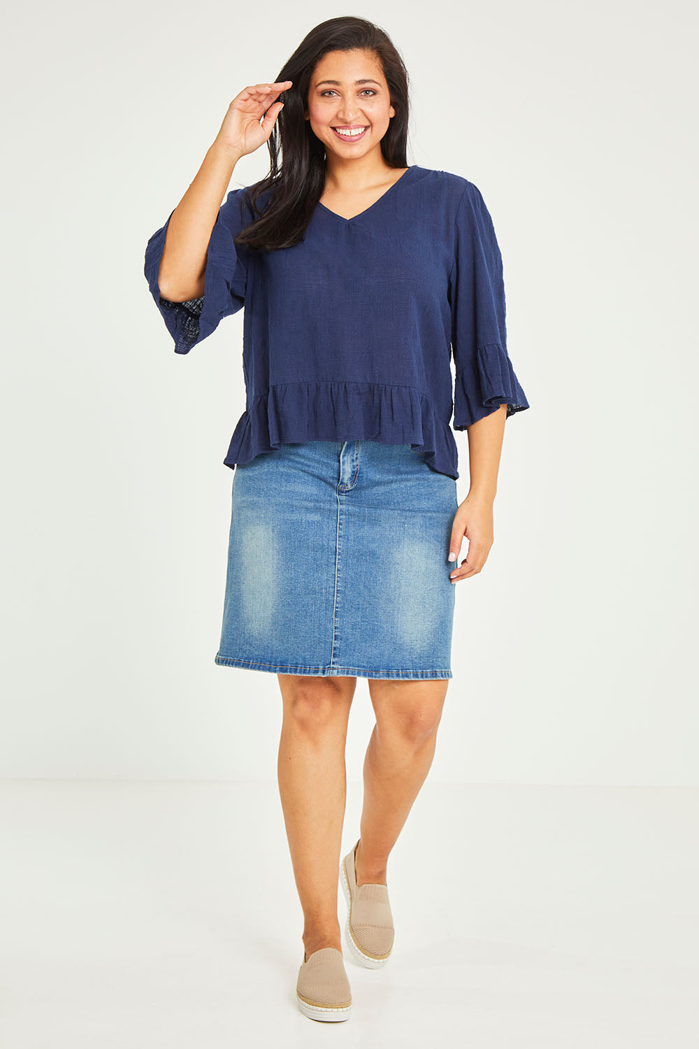 Model Terri-Leigh wearing size 14 of the Ruffle Top in colour Navy (Blue), from the front, showing the whole outfit