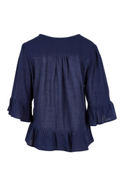 Product shot of the Ruffle Top in colour Navy (Blue), from the back