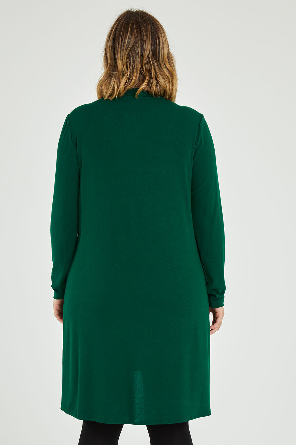 Model Jess wearing size 14 of the Overlay Tunic in colour Forest (Green), from the back