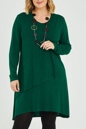 Model Jess wearing size 14 of the Overlay Tunic in colour Forest (Green), from the front, cropped image