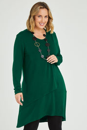 Model Jess wearing size 14 of the Overlay Tunic in colour Forest (Green), from the front, cropped image